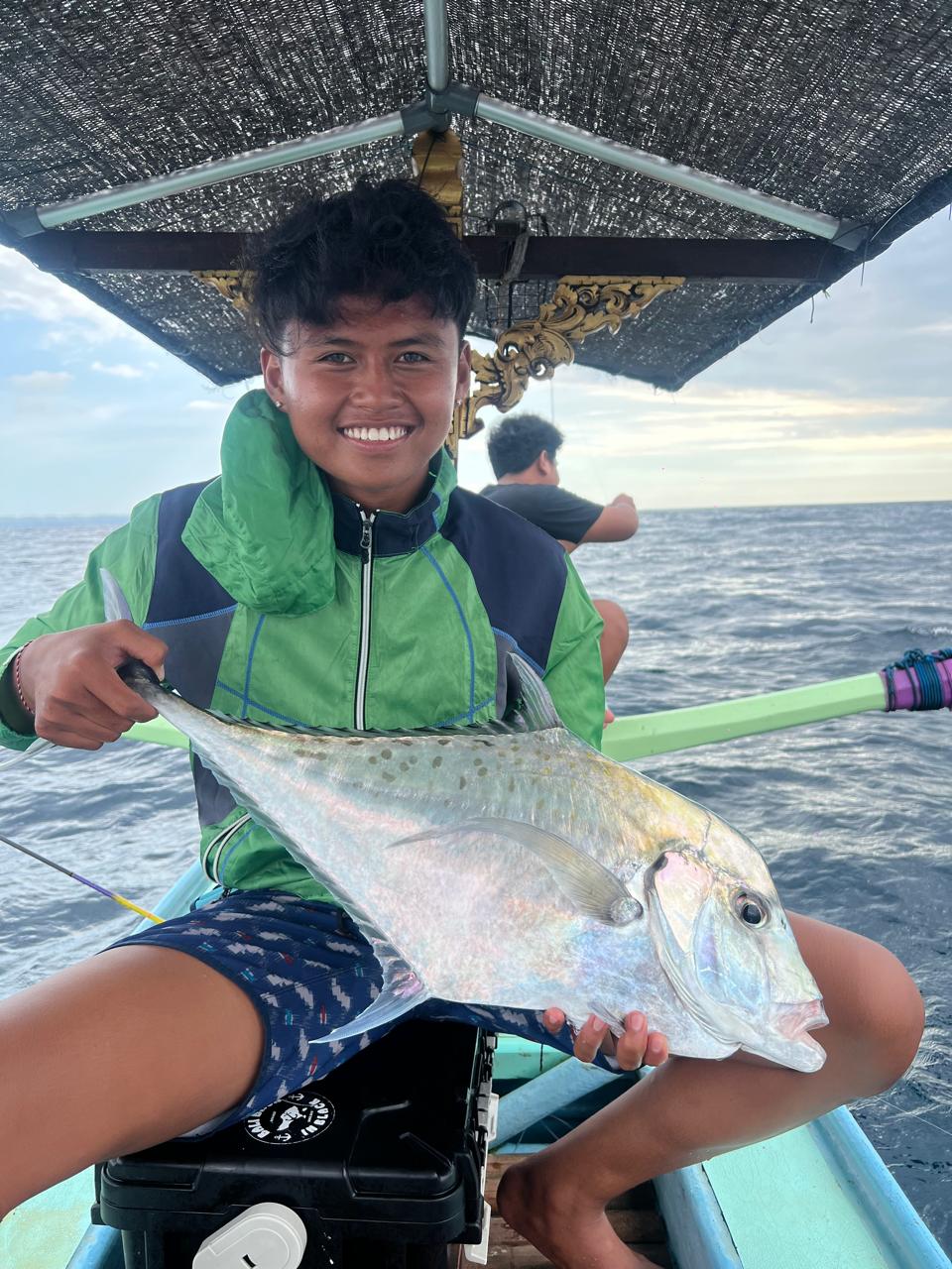Crew member Rusty with a fresh catch