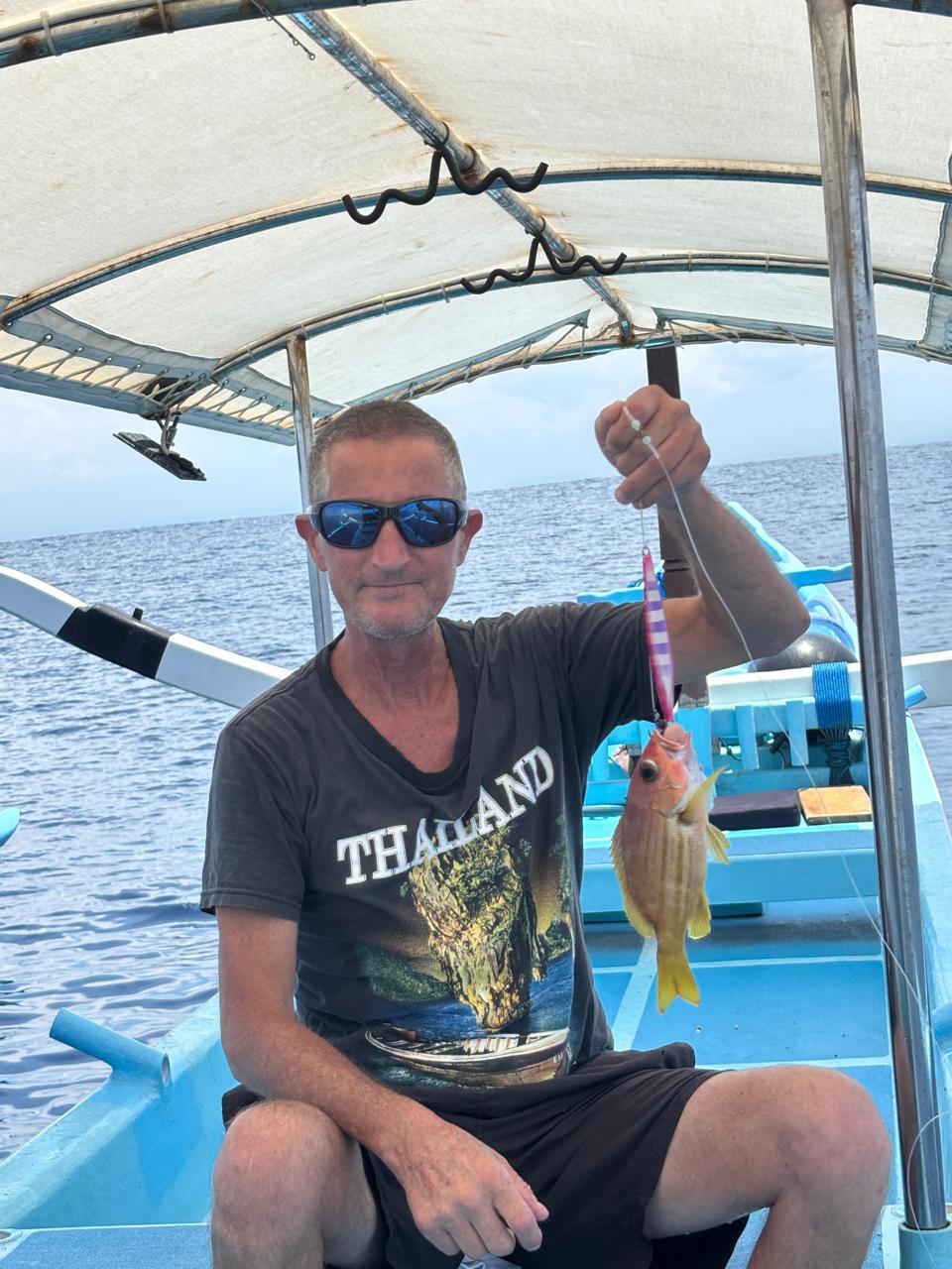 Fresh catch displayed on the blue boat