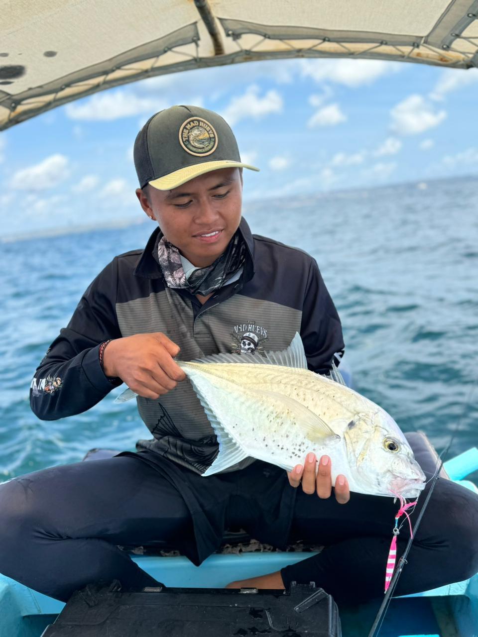 Instructor Putu examining a fresh catch