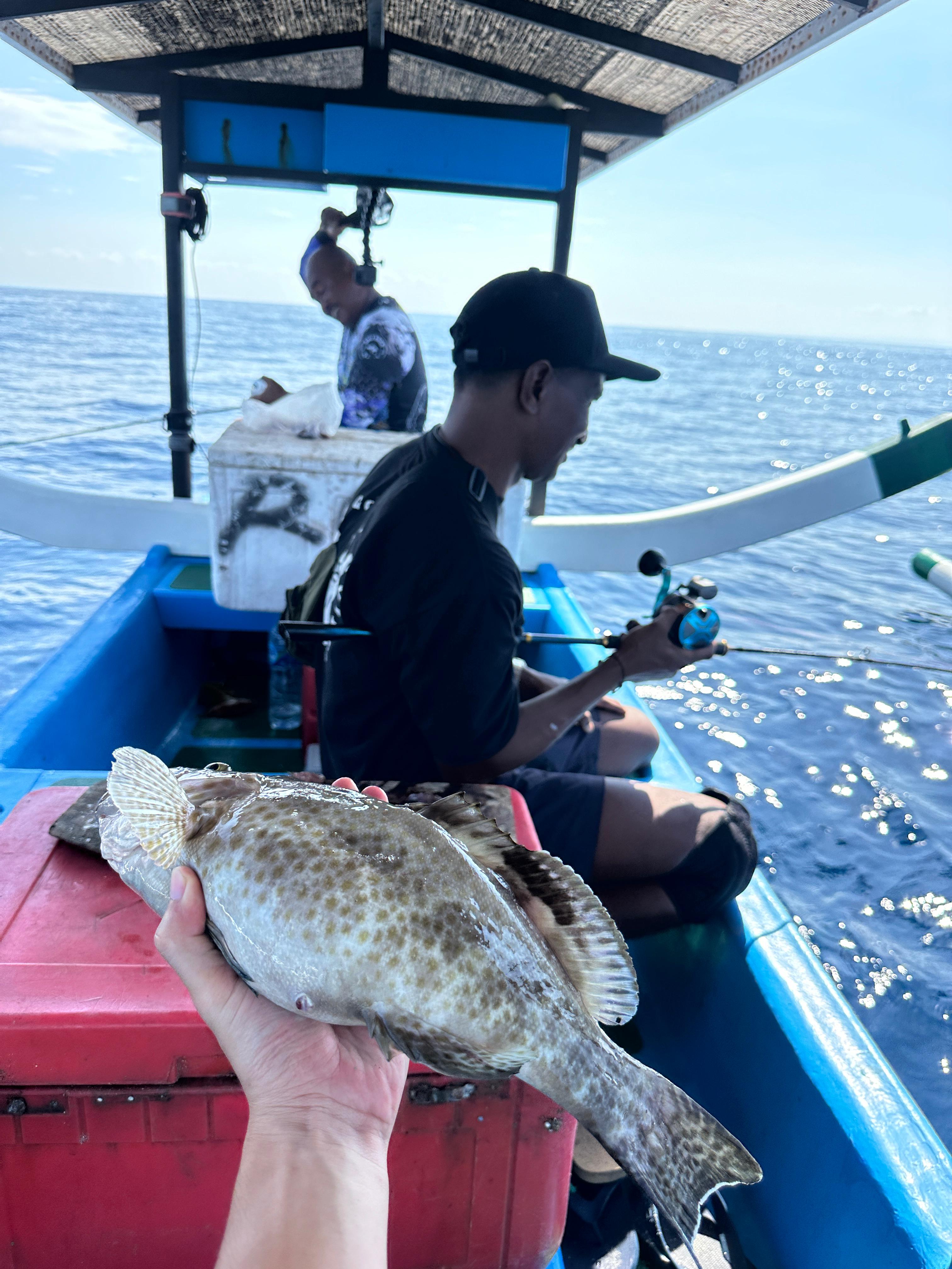 Fisherman showing off catch on deck