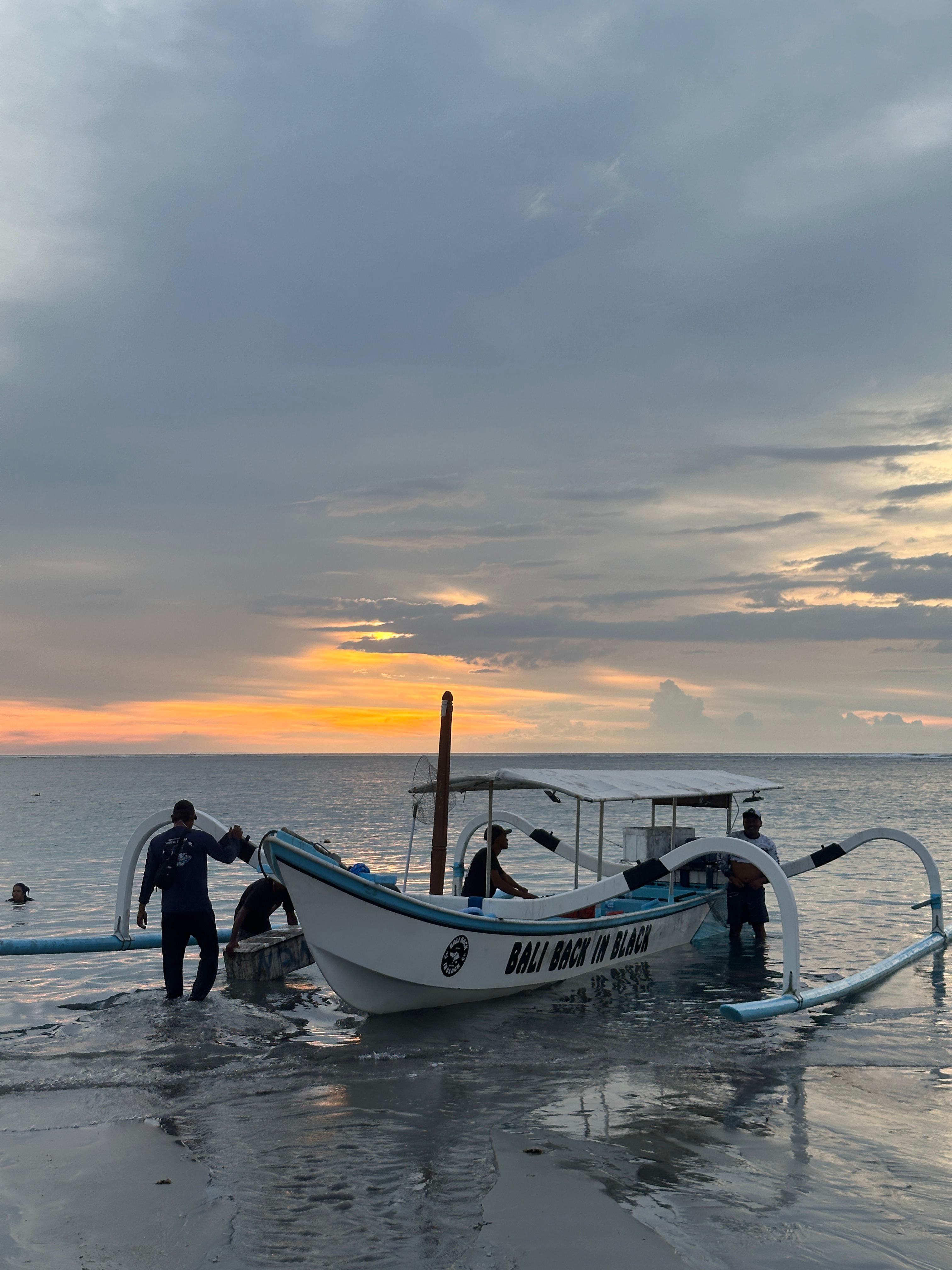 Traditional boat silhouette at sunset on the Indian Ocean
